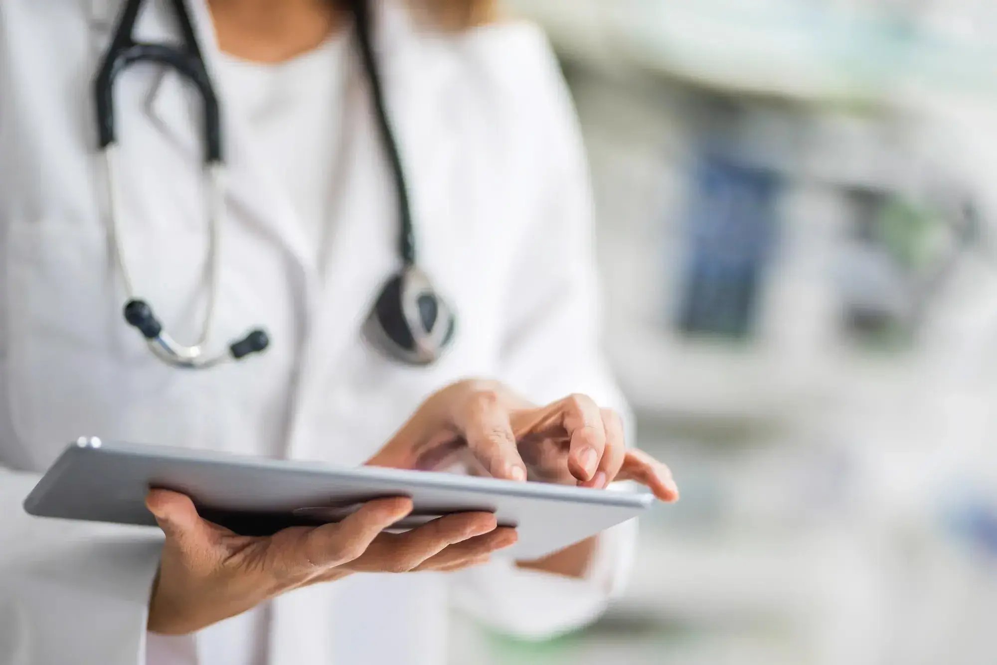 doctor-typing-on-a-tablet